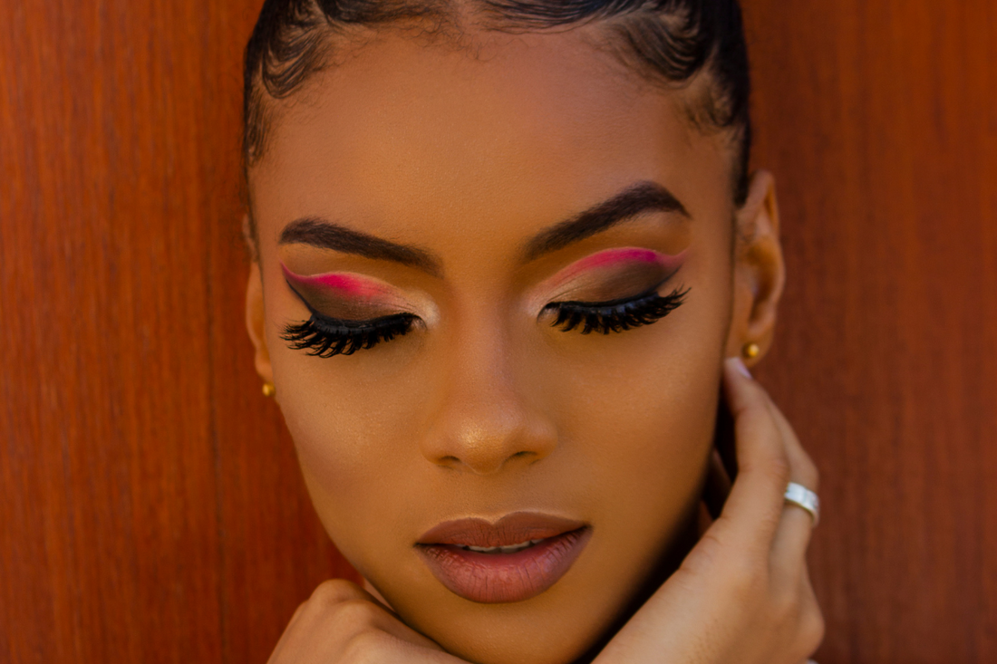 A gorgeous woman wearing synthetic eyelashes and eyeshadow makeup